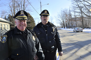 Two New Salem town police officers standing in front of the Stowell Building