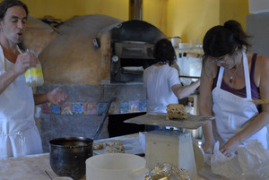 Hungry Ghost Bread: bakers at work in front of the oven