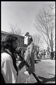 Stilt walker and clarinetist performing with Bread and Puppet Theater
