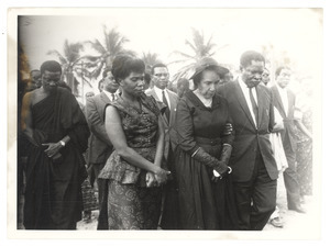 Unidentified minister of the Ghanaian government escorting Shirley Graham Du Bois at the state funeral for W. E. B. Du Bois