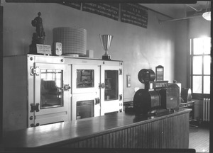 Electric refrigerator with trophies won by Massachusetts Agricultural College Dairy Industry Team