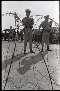 Antiwar demonstration at Fort Dix, N.J.: view of military police through barbed wire