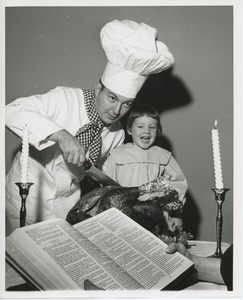 Chef Michael Malone and Leslee Trimble with turkey and woman reading bible