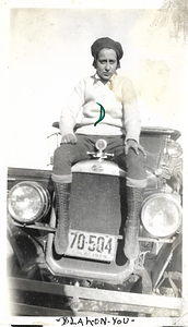 A Photograph of Dorris Bullard Sitting on a Car