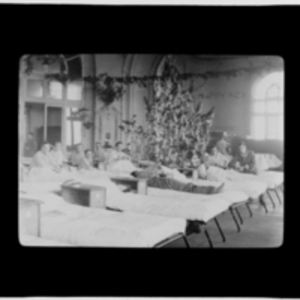 Patients around the ward's Christmas tree