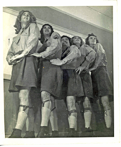 Five Performers Posing in a Line