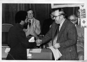 Suffolk University Dean Michael Ronayne (CAS) presents an award to a student at the 1976 Recognition Day ceremony