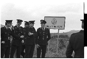 Dominic McGlinchey INLA leader handover from RUC. Garda straying inadvertently over the border while waiting for the actual handover, passing a sign "Welcome to Mourne Country."