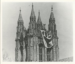 Gasson Hall exterior: bell tower with flag during strike