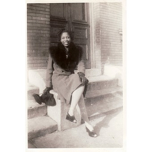 Viola Thacker poses on the stairs of an unknown building