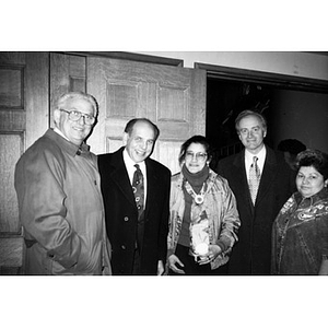 Clara Garcia and Carmen Colombani with three unidentified men in suits.
