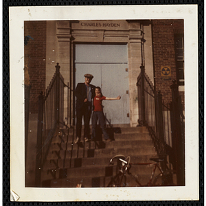 A man and a boy posing together on the front steps at the South Boston Boys' Club