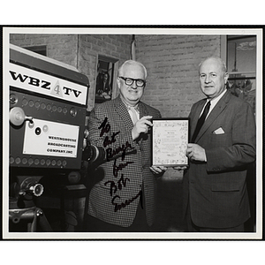 "Bob Emery (left) receives "Great Guys" award from Arthur T. Burger, Executive Director of the Boys' Clubs of Boston (right)"