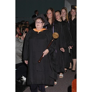 Faculty member leads student procession into School of Nursing convocation