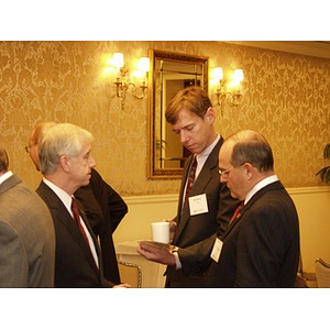 Bill Davis and Robert DiCenso, center and right, speaking at the College of Business Administration's CEO Breakfast Forum