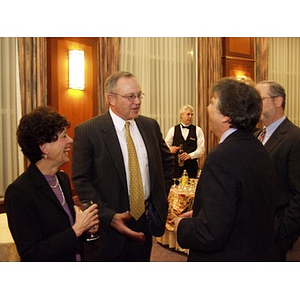 Guests conversing at the College of Business Administration's Distinguished Service Awards ceremony