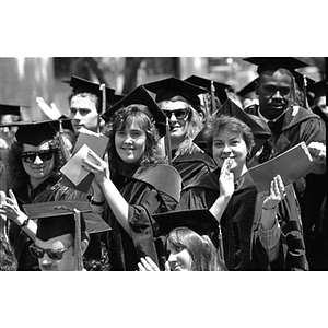 School of Law graduates applauding at the 1990 commencement ceremony