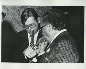 Douglas Ireland and Meade Esposito smoking cigars