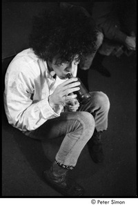 Tim Buckley at the Catacombs: Buckley backstage, drinking from a beer bottle