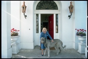 Margaret Heckler, United States Ambassador to Ireland, at the door of her residence, greeting her Irish wolfhound, Jackson O'Toole