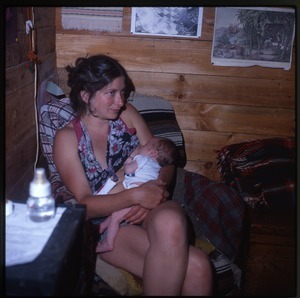 Nina Keller feeding baby, Montague Farm Commune