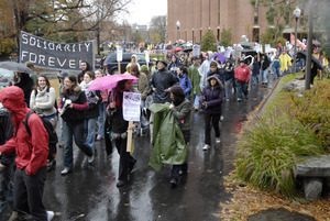 UMass student strike: strikers marching past the Du Bois Library
