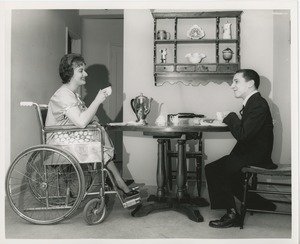 June Trietsch Arzt in wheelchair and unidentified man with disability having tea