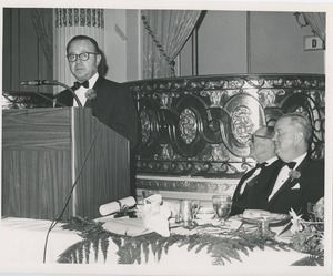 Unidentified man speaking at a podium at an ICD event