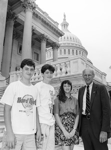 John Olver and visitors on the steps of the United States Capitol building