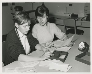 Woman instructing another woman