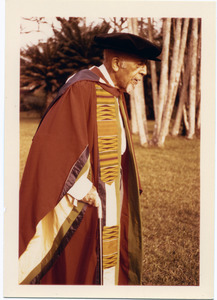 W.E.B. Du Bois, wearing academic regalia, receiving an honorary degree from the University of Accra