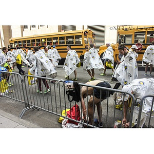 Group of runners wearing thermal blankets after completing the 2013 Boston Marathon