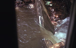 View of V-notch weir on the South Branch Birch Brook Stream Gauging Station from well house window. Morning after the 2.5" overnight (29-30 June 1973) rainfall event.