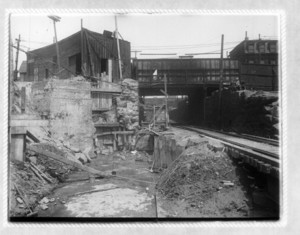 View of railroad tracks passing under a bridge