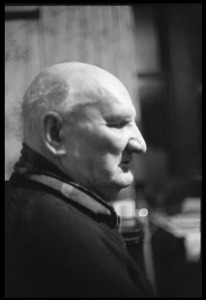 Portrait of an older man in profile in a Scottish pub