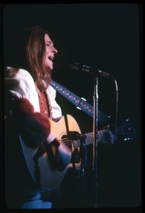 Judy Collins: with guitar, performing on stage