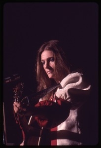 Judy Collins: with guitar, performing on stage