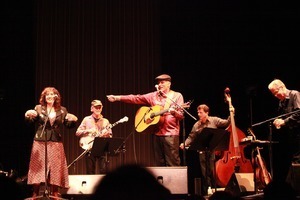 Jim Kweskin Jug Band performing in Japan: R. to l.: Maria Muldaur (far left) and Jim Kweskin (guitar)