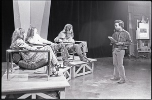 Commune members at the WGBY Catch 44 (public access television) interview: shot from the side of Anne Baker, Jim Baker, and Bruce Geisler (l. to r.) on stage