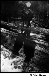 Verandah Porche (right) and Rico (Richard Wizansky) casting shadows on a snowy road, Packer Corners commune