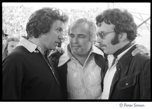 Bill Graham (left) talking to Marlon Brando and unidentified man