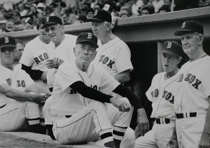 Members of the Red Sox 1946 pennant-winning team await their introductions in the dugout