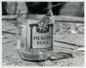 Broken bottle of pickled eggs