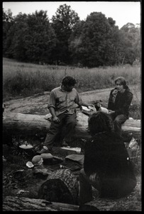 Sitting around a campfire, Montague Farm commune