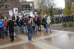 UMass student strike: strike organizer with a bullhorn, leading the march past Machmer Hall