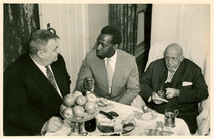 W. E. B. Du Bois and others gathered around table in Soviet Union