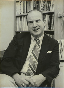 David A. Booth sitting indoors