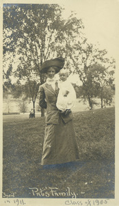 Wife and child of Pat Williams outside