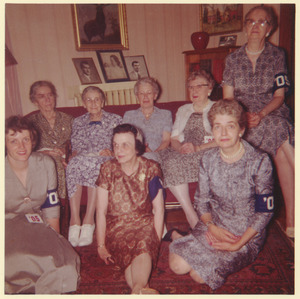 Female members of the class of 1905 sitting on a couch indoors