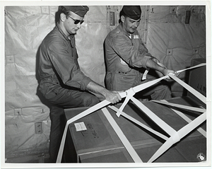 United States Air Force members inspecting cargo